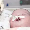 Baby with feeding tube