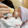 Baby being fed